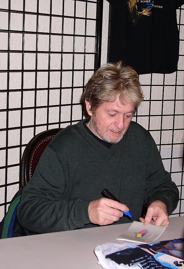 Jon Anderson signing an Autograph Photograph by Melinda Saminski