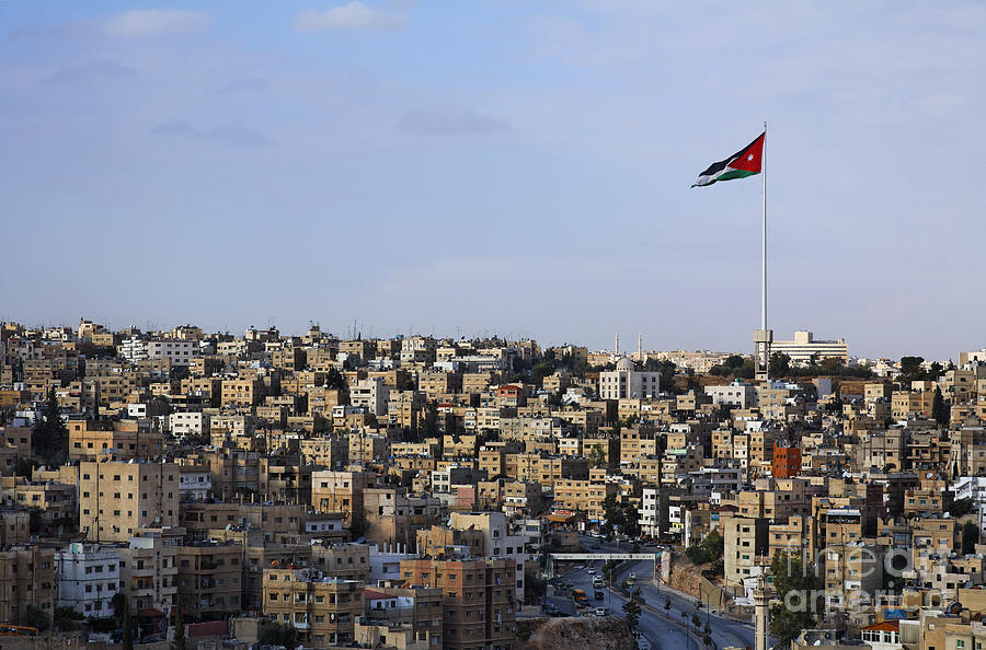 Jordanian flag flying over the city of Amman Jordan Photograph by ...