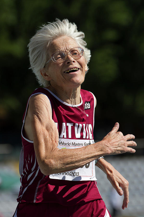 Sports Photograph - Joyful Senior Female Athlete by Alex Rotas