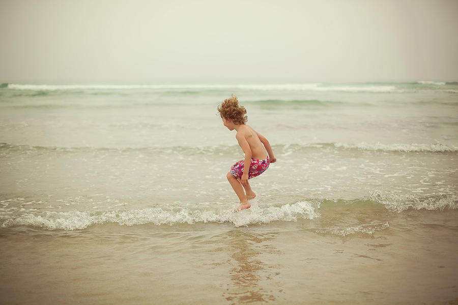 Jumping At The Beach Photograph by Carol Yepes