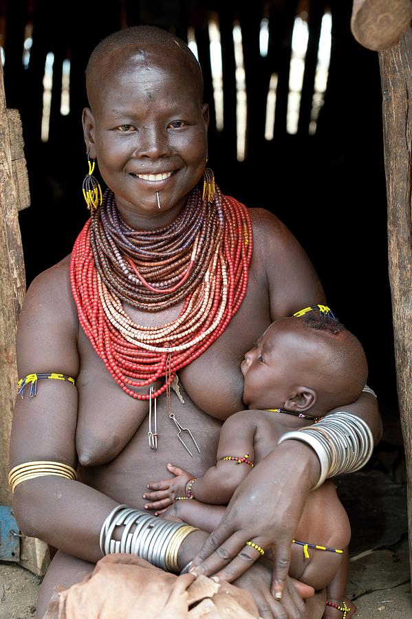 Karo Woman Breast Feeding Photograph by Tony Camacho