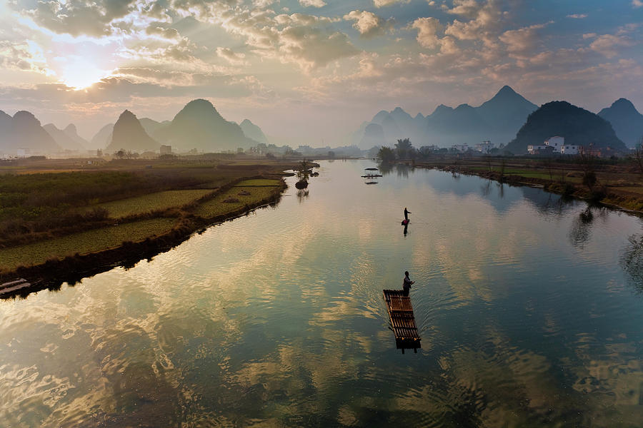 Karst Mountains And Fishermen On Rafts Photograph by Richard I'anson ...