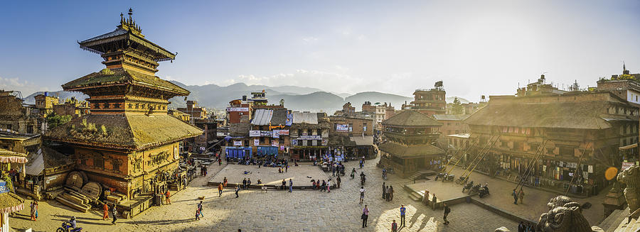 Kathmandu golden sunset light illuminating ancient square temples Bhaktapur Nepal Photograph by fotoVoyager