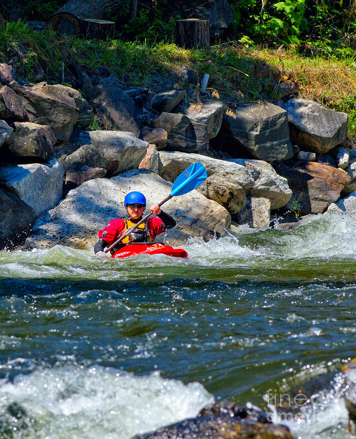Kayaker on rock river Photograph by Les Palenik