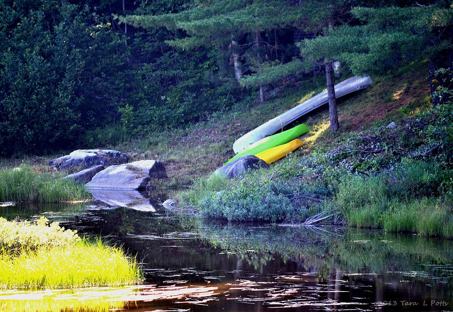 Kayaks and Canoe Near the Golden Road Photograph by Tara Potts