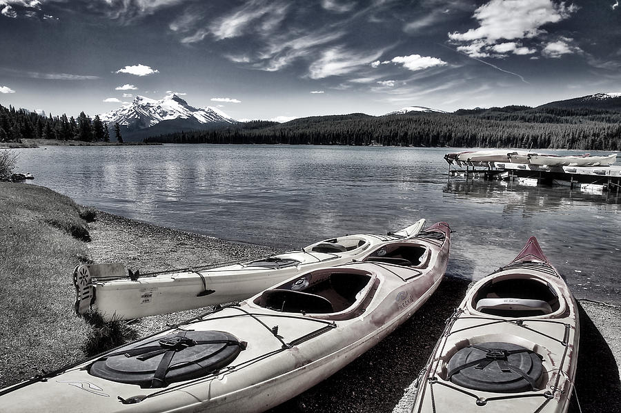 Kayaks At Maligne Lake - Black and White Photograph by Stuart Litoff
