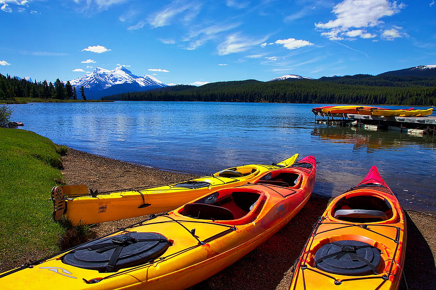 Kayaks at Maligne Lake Photograph by Stuart Litoff