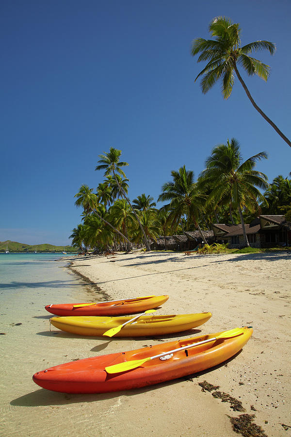 Beach Photograph - Kayaks On The Beach, Plantation Island by David Wall
