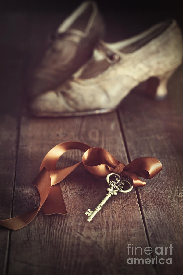 Key with ribbon and shoes Photograph by Sandra Cunningham