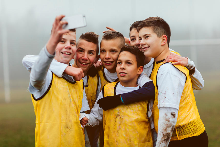 Kids Making Selfie After Playing Soccer. Photograph by Vgajic