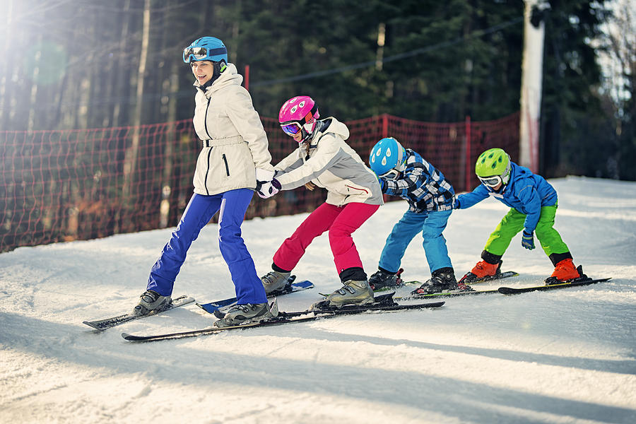 Kids practicing skiing with ski school instructor Photograph by Imgorthand