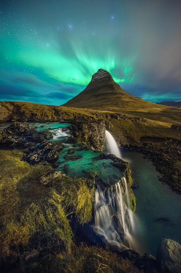 Kirkjufell with northern light in the sky Photograph by Coolbiere Photograph