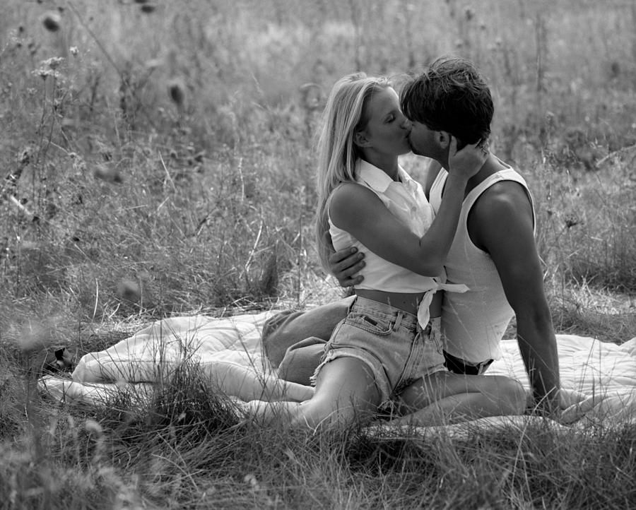 Kiss in the Grass Photograph by Jon Neidert