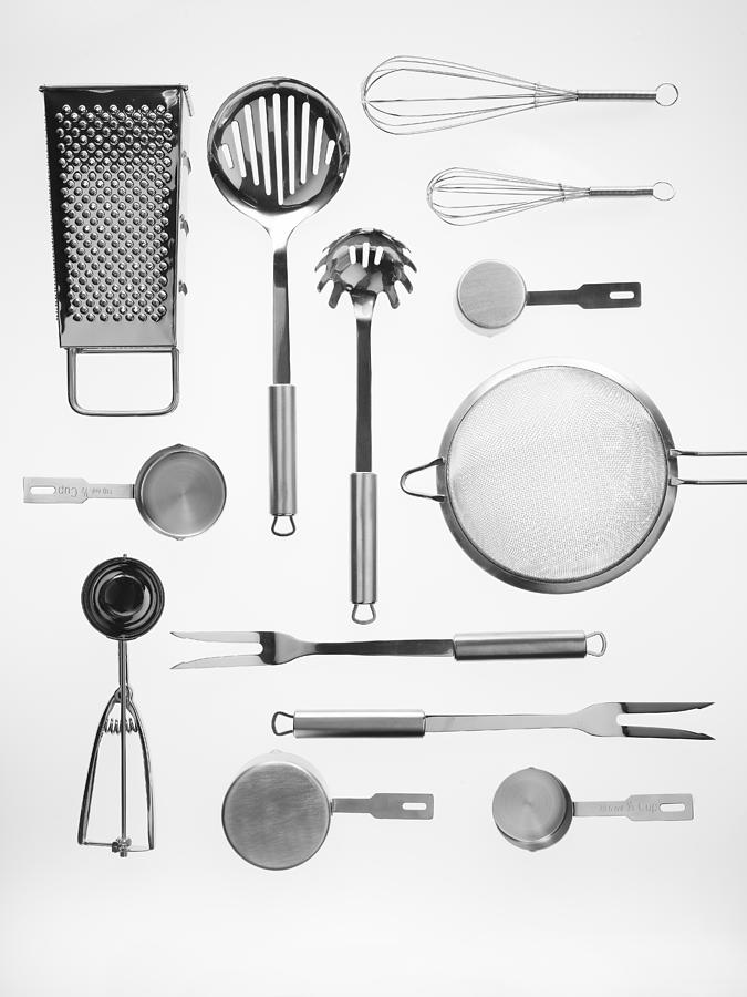 Kitchen tools on white background Photograph by Shana Novak