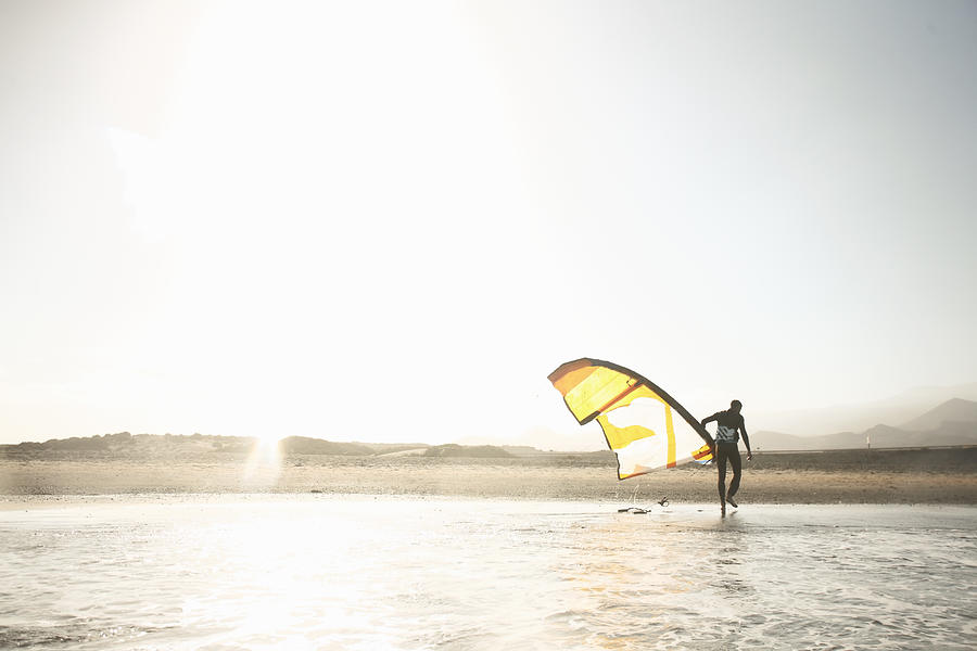Kitesurfer On Beach At Sunset Photograph by Stanislaw Pytel