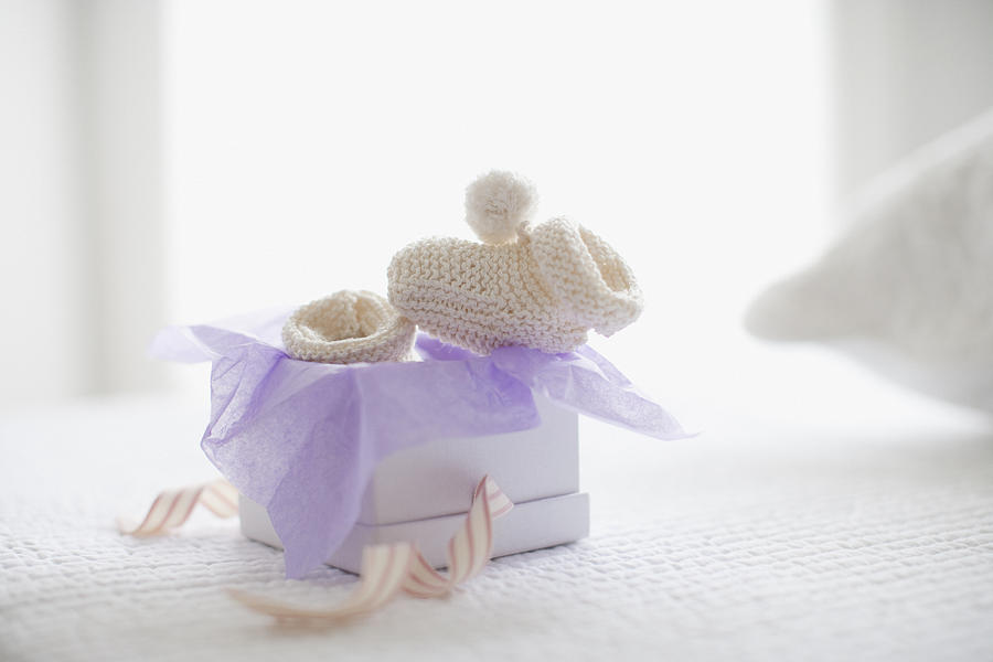 Knit baby booties in gift box Photograph by Robert Daly