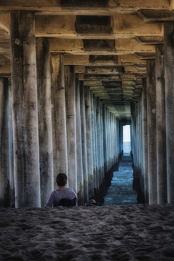 Huntington Beach Photograph - Knitter Under the Pier by Joan Carroll