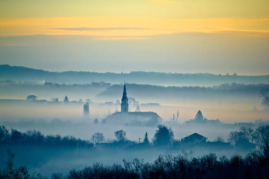 Krizevci cathedral in fog landscape Photograph by Brch Photography