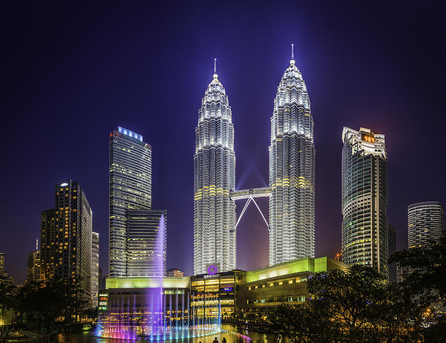 Kuala Lumpur neon night Petronas Towers KLCC Park illuminated Malaysia Photograph by fotoVoyager