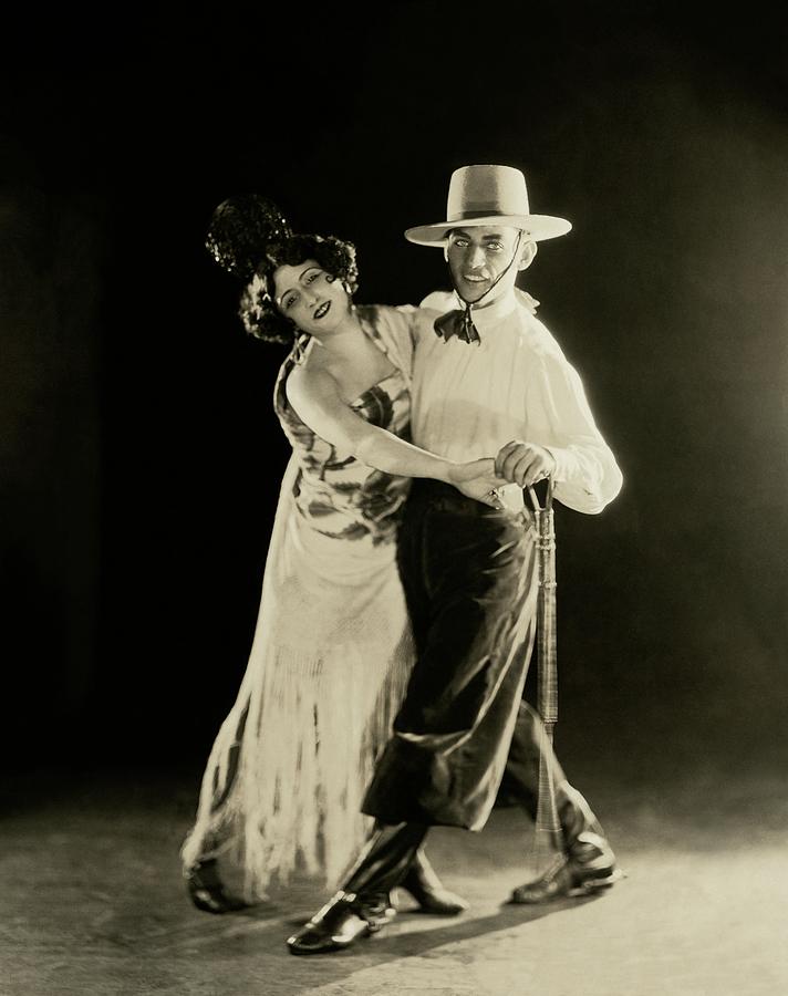 La Argentina Dancing With A Man Photograph by James Abbe