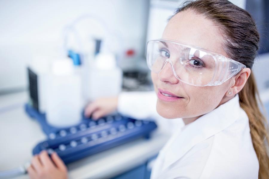 Lab Assistant Using Equipment Photograph by Science Photo Library | Pixels