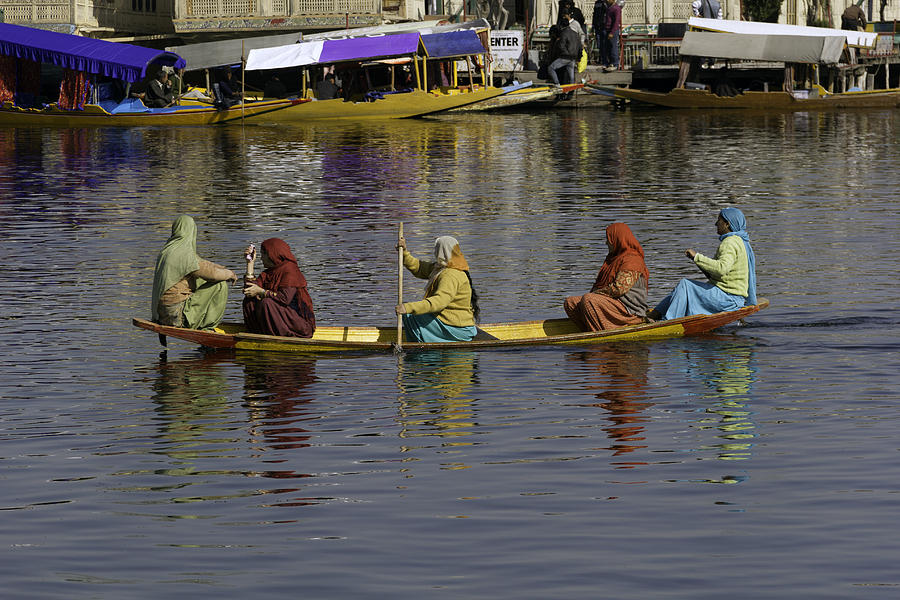 Landscape Photograph - Ladies on a wooden boat on the Dal Lake by Ashish Agarwal