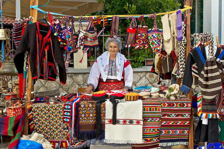 Lady in traditional clothes selling on booth Photograph by Brch Photography