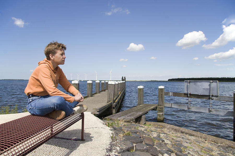 Lady Sits On A Bench In The Eemmeer Spakenburg Bunschoten Netherlands 