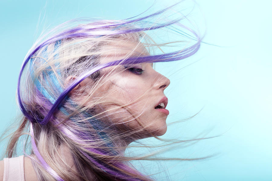 Lady with colorful hair flying over her face Photograph by Paper Boat Creative
