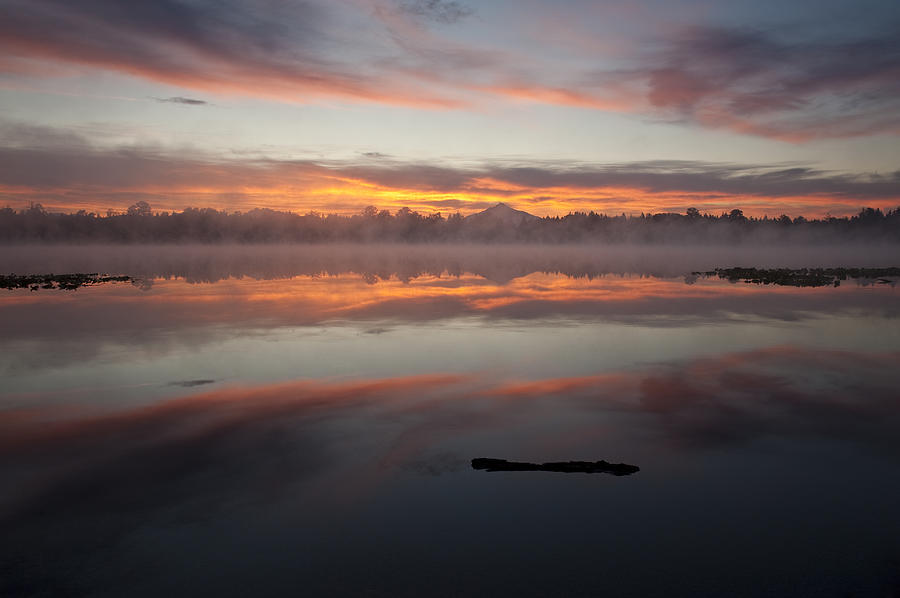 Lake Cassidy reflections dramatic clouds Photograph by Jim Corwin