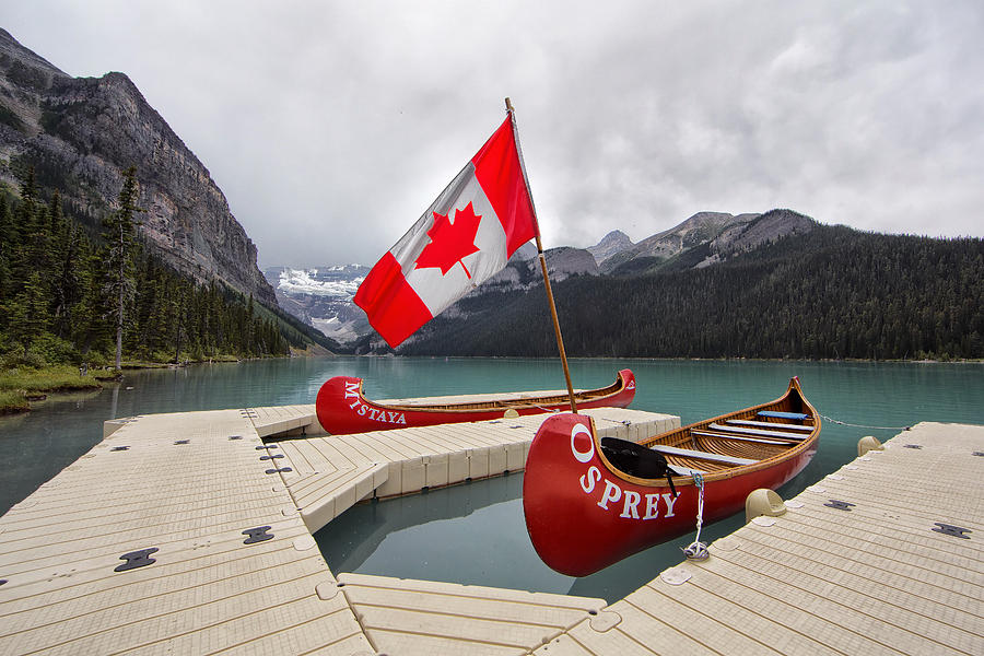 Lake Louise Canoes and Flag Photograph by Jack Nevitt