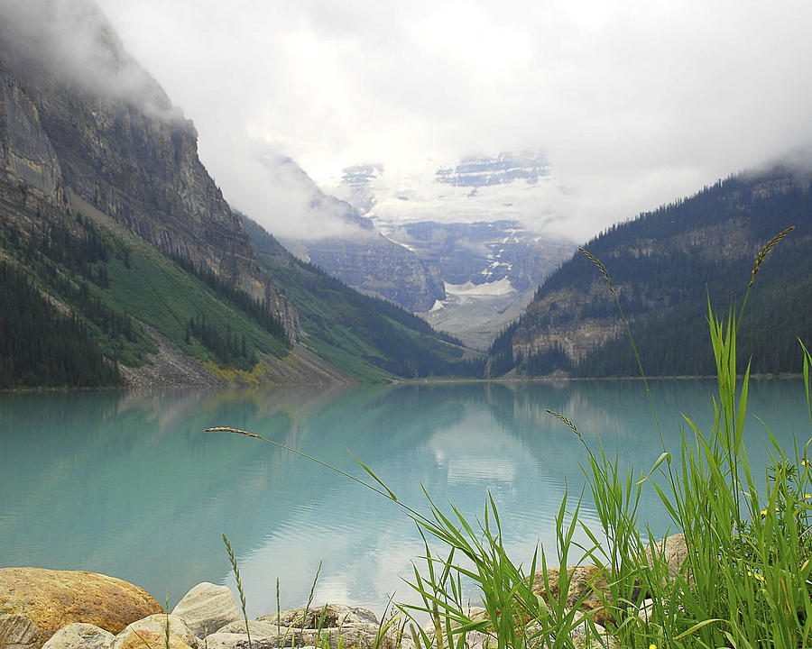 Lake Louise under Clouds Photograph by Betty Eich