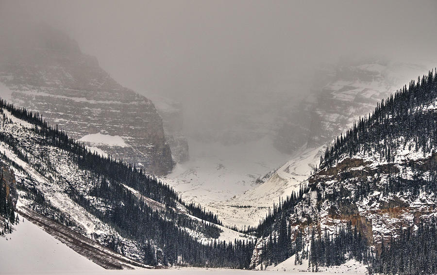 Banff National Park Photograph - Lake Louise Under Snow Clouds by Phil And Karen Rispin
