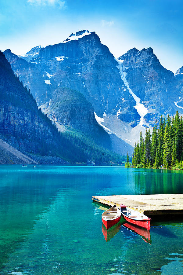 Lake Moraine and Canoe Dock in Banff National Park Photograph by YinYang