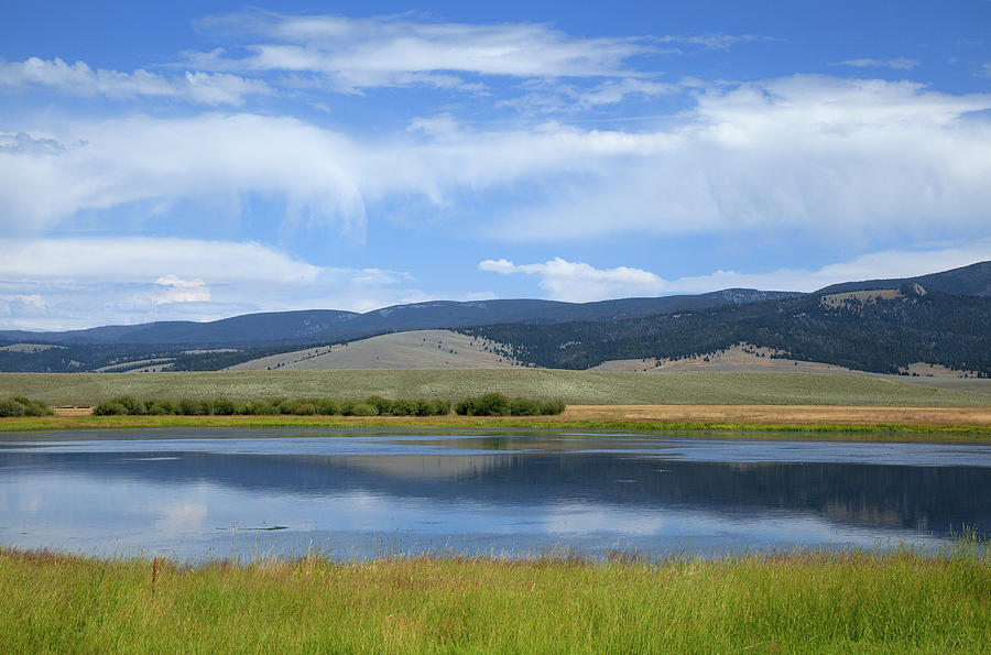 Lake Surrounded By Grasses, Hills And Photograph by Timothy Hearsum
