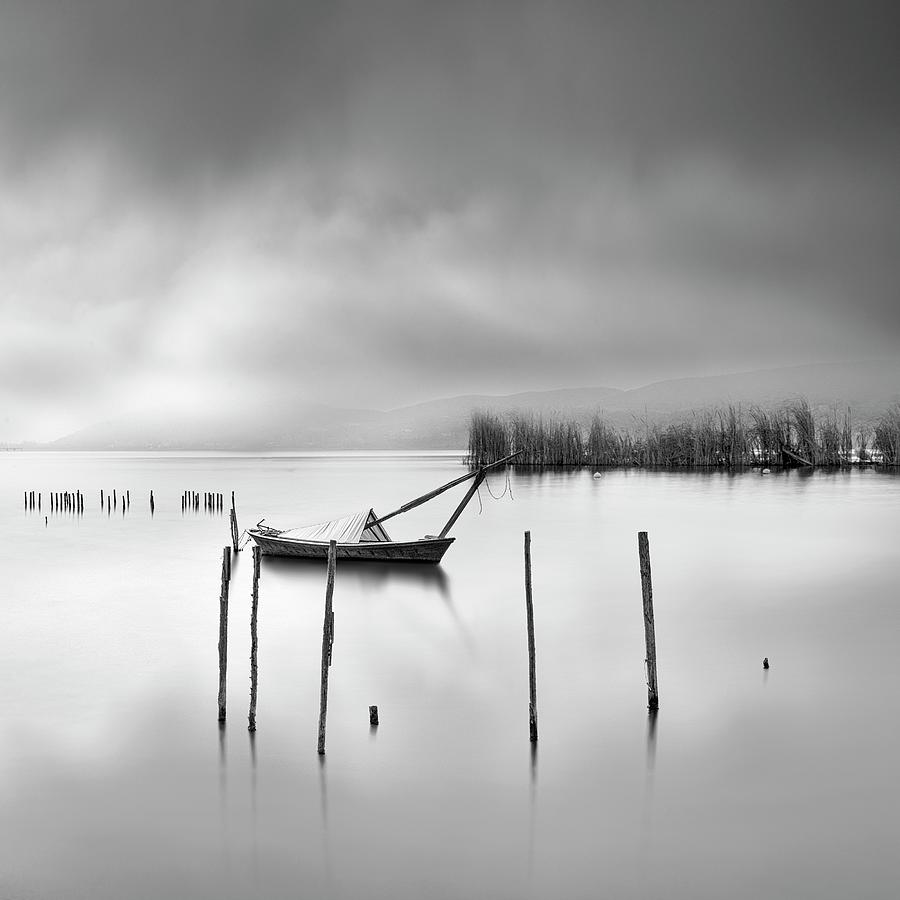 Black And White Photograph - Lake View With Poles And Boat by George Digalakis