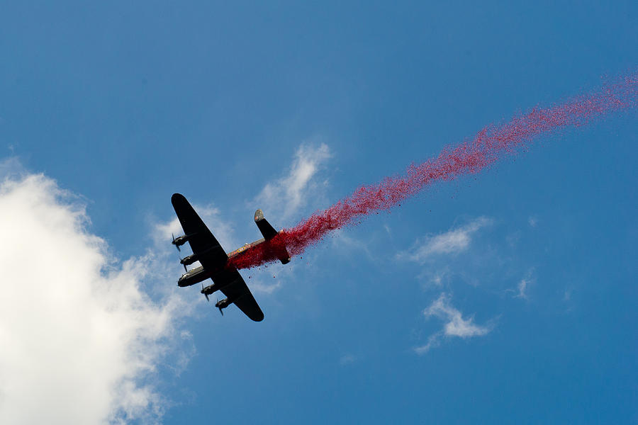 Lancaster bomber drops poppies over London Photograph by Gary Eason