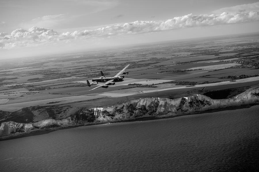 Lancaster over the white cliffs in Kent black and white version Photograph by Gary Eason