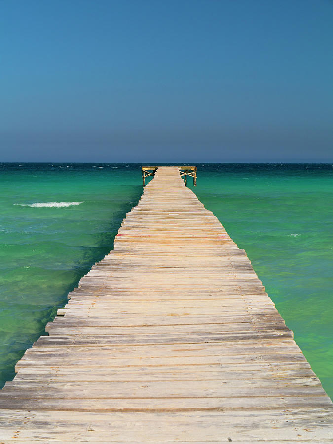 Landing Jetty Over Clear Seas by Travelpix Ltd