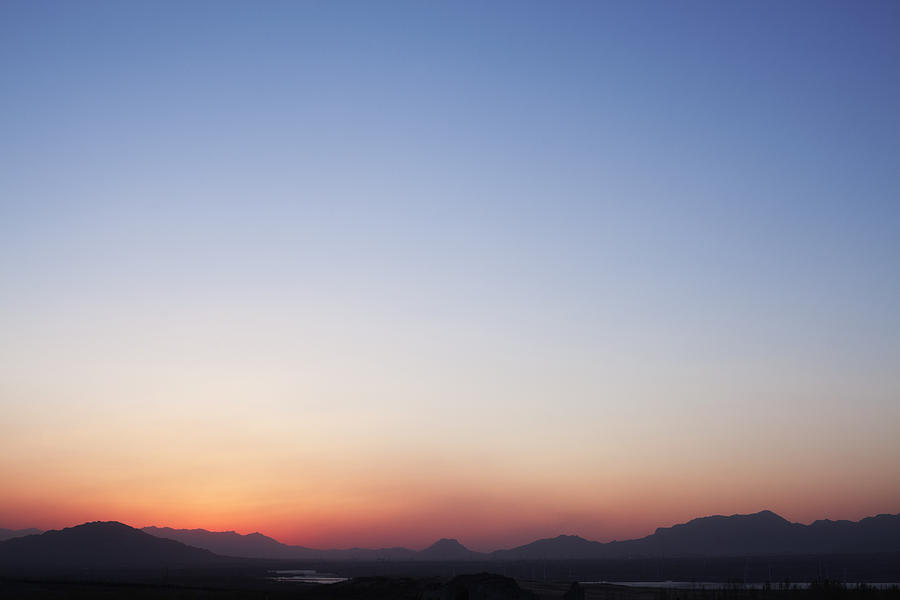 Landscape of mountain range and the sky at dusk, China Photograph by XiXinXing