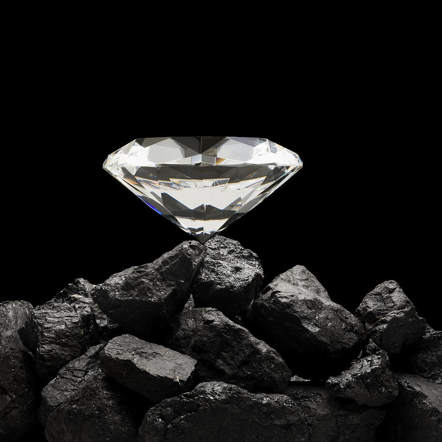 Large Diamond On Top Of A Pile Of Rocks Photograph by Mike Kemp