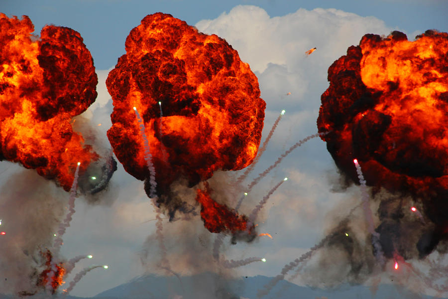 Large explosion made by fire bomb drops at an airshow display Photograph by By Ale_flamy