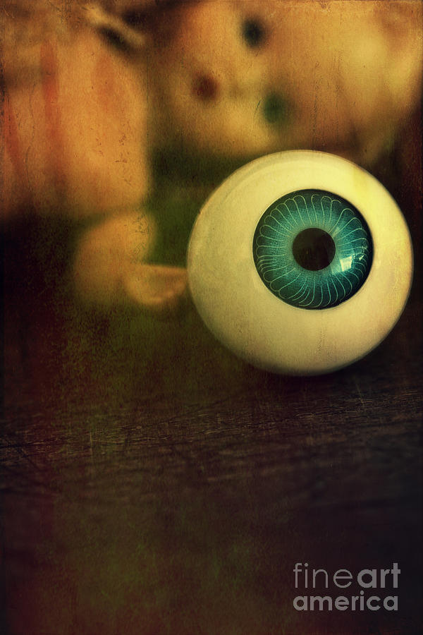 Large eyeball with doll face in background Photograph by Sandra Cunningham