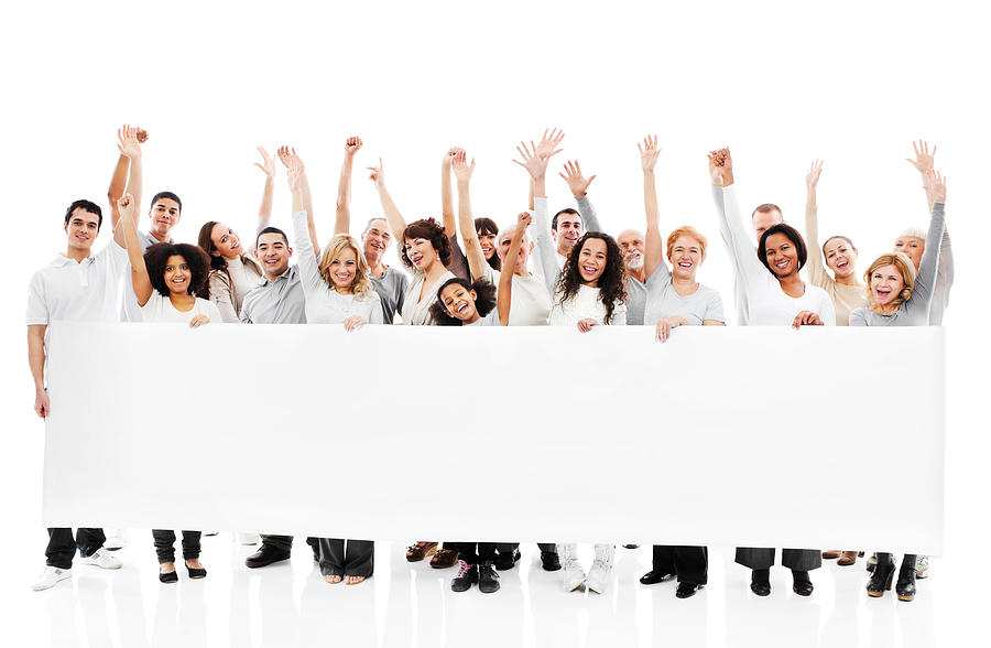 Large group of happy people holding a white board. Photograph by Skynesher