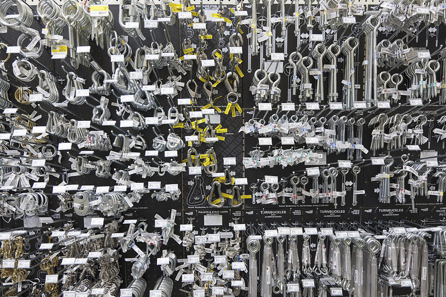 Large group of metallic equipments on display in hardware store Photograph by Moodboard