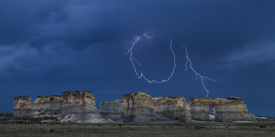 Lariat lightning at Monument Rocks Photograph by Rob Graham