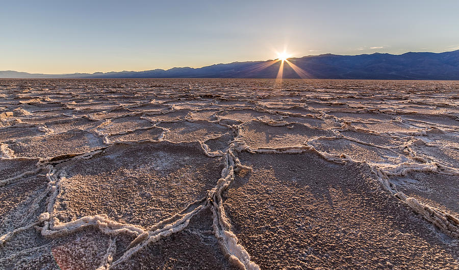 Last sun burst at Badwater Death Valley Photograph by Pierre Leclerc Photography