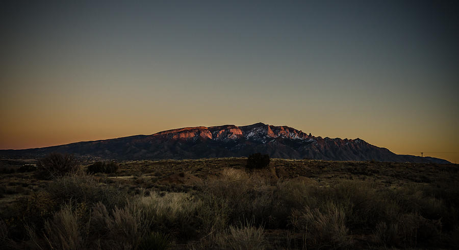 Last Sun Light on Sandia Mountains Photograph by Anthony Doudt