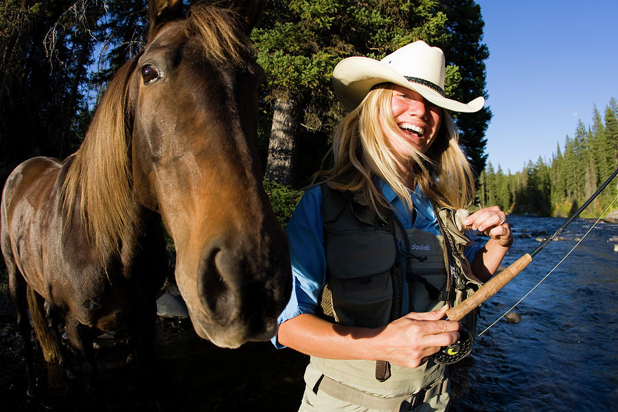 Laughing Blonde Girl Fly Fishing by Gabe Rogel