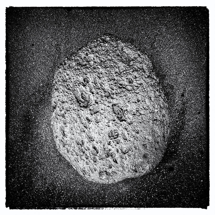 Abstract Photograph - Lava Stone on black basalt sand by Matthias Hauser